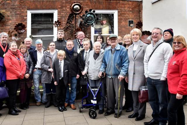 A crowd gathered on Carolgate in Retford to see the artwork which was unveiled by chairman of Bassetlaw District Council, David Challinor