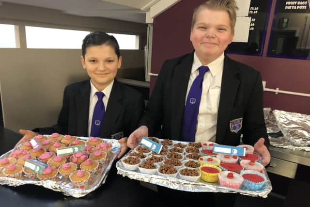 John Brocklesby, 13, a Year 8 student council member is pictured with Ollie White Year 8 president.