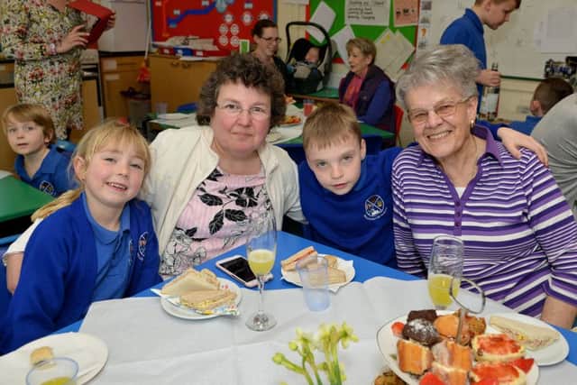 Motherâ¬"s Day afternoon tea at Willoughton Primary School, pictured are Harleigh Everatt, six, Sally-Ann Everatt, Preston Everatt and Jenny Everatt