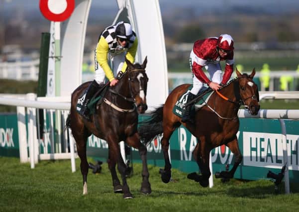 Tiger Roll (right) just holds off Pleasant Company to win last year's Grand National. Both are back for more on Saturday. (PHOTO BY: Alex Livesey/Getty Images).