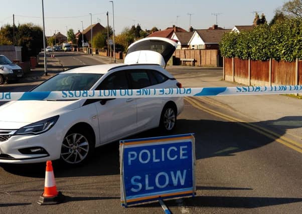 Police sealed-off Park Hall Road, at Mansfield Woodhouse, as part of a murder investigation.