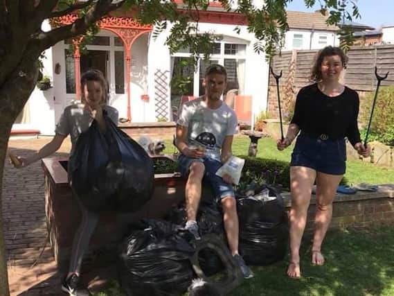 Sophie, Tyler and Claudia with the rubbish they collected.