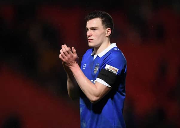 DONCASTER, ENGLAND - JANUARY 26:  George Edmundson of Oldham Athletic applauds fans after the FA Cup Fourth Round match between Doncaster Rovers and Oldham Athletic at Keepmoat Stadium on January 26, 2019 in Doncaster, United Kingdom.  (Photo by Laurence Griffiths/Getty Images)
