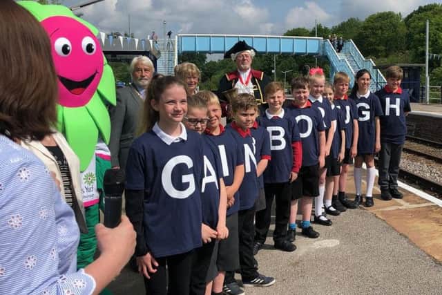 Youngsters from The Gainsborough Parish Church Primary School await the train's arrival