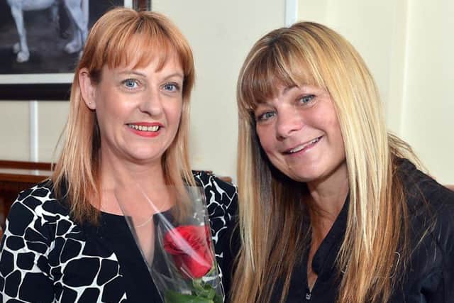 Linda Foy is presented the Guardian Rose by Lisa Sprowell.