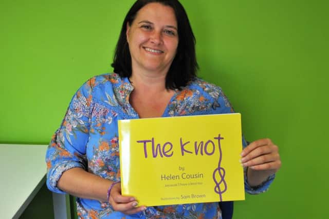 Misterton mum Helen Cousin with her book for children, The Knot.