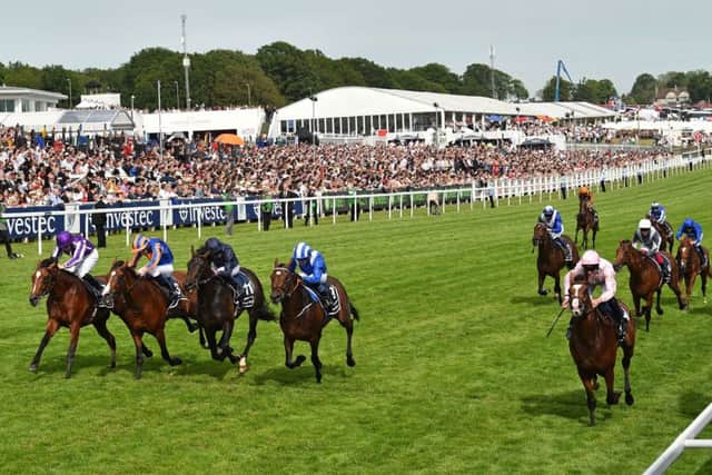 Five in a line as Anthony Van Dyck (nearside) pips four rivals to win Saturday's Investec Derby at Epsom. (PHOTO BY: Glyn Kirk/Getty Images).