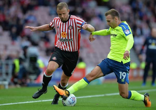 Rugged Sunderland midfielder Lee Cattermole (left), who is reportedly wanted by Sheffield Wednesday. (PHOTO BY: Mark Runnacles/Getty Images)