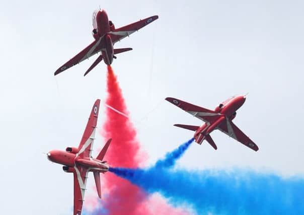 A typically spectacular routine by the Red Arrows aerobatics display team. (PHOTO BY: Dan Kitwood/Getty Images)