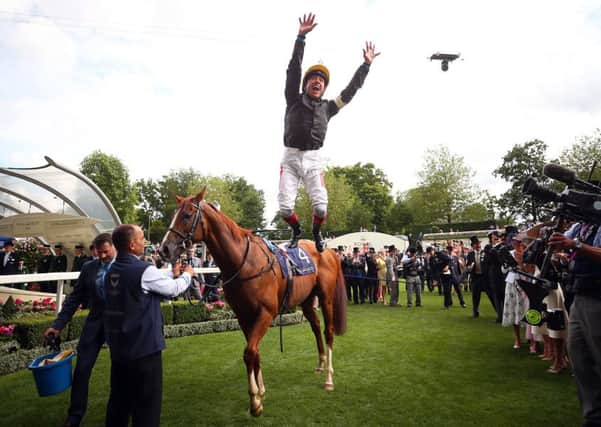 Frankie Dettori treats the crowd to his trademark flying dismount after winning the Gold Cup at Royal Ascot on Stradivarius (PHOTO BY: Bryn Lennon/Getty Images)
