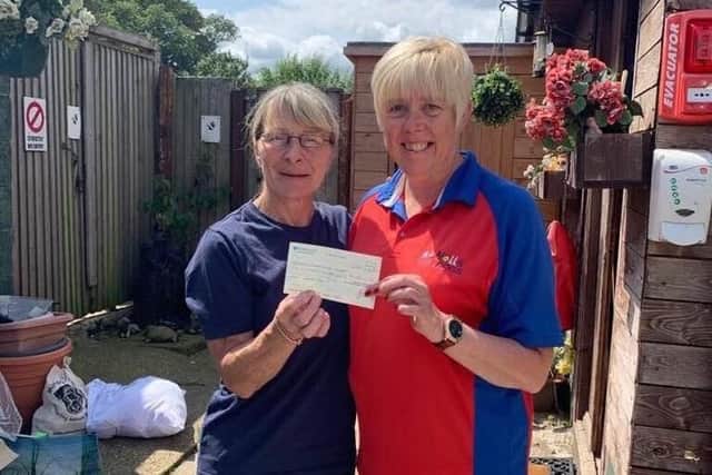A cheque for 600 is presented to Elaine Shaw from Notts Super Dogs