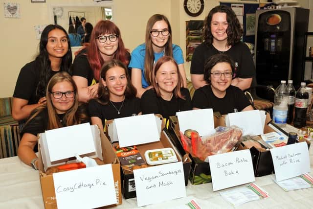 NCS students pictured with their food boxes and recipe cards.