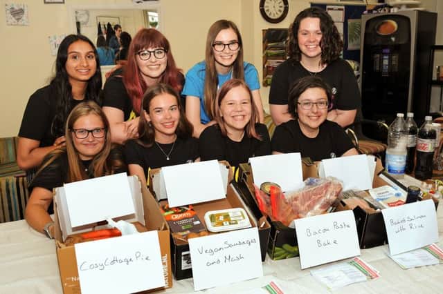 NCS students pictured with their food boxes and recipe cards.