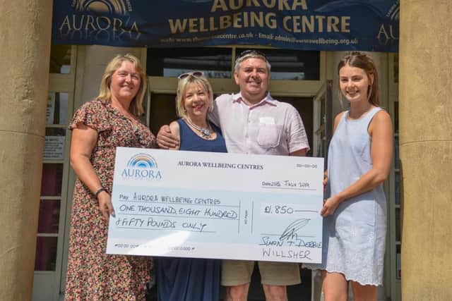 Cheque presentation to Aurora Wellbeing Centre, Worksop from newlyweds Simon and Debbie Wilsher, the couple present their cheque to manager Deborah Fores and Macmillan Wellbeing Practitioner, Emma Walker
