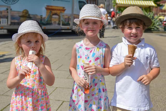Enjoying some cool treats in the sunshine are Maisie Arthur, three, Olivia Arthur, six and Jasper, four