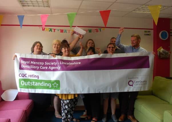 Staff celebrate the outstanding rating awarded to Mencaps domiciliary care service in Lincolnshire.