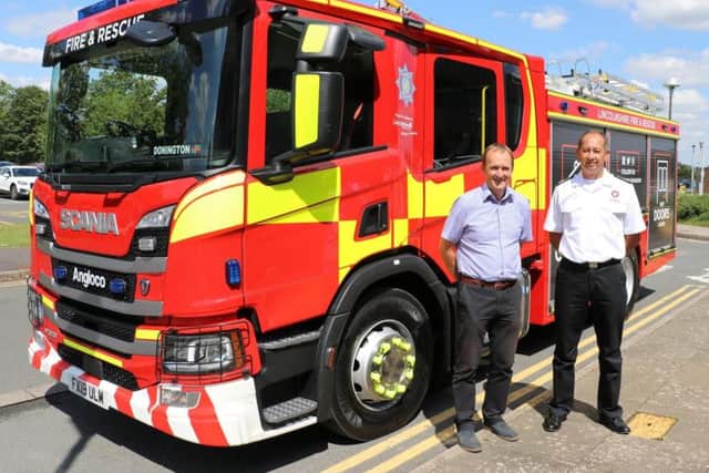 Chief Fire Officer Les Britzman and Coun Nick Worth with the first of the new fire appliances.