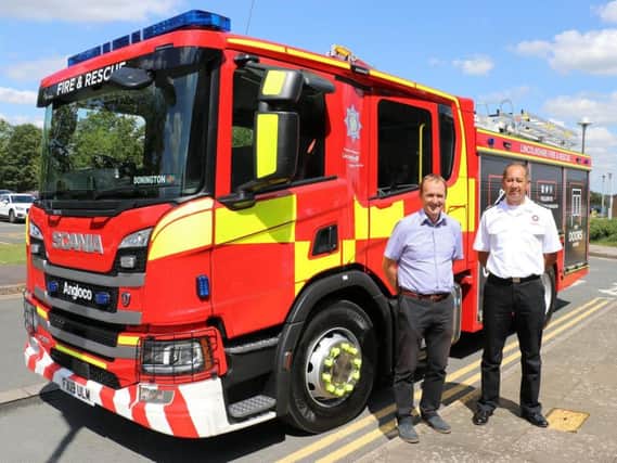 Chief Fire Officer Les Britzman and Coun Nick Worth with the first of the new fire appliances.