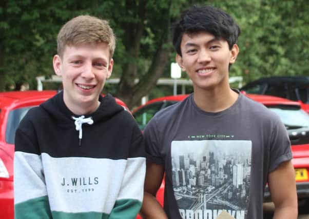 Two QEHS students full of smiles after receiving their results.
