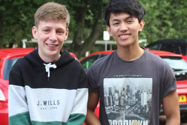 Two QEHS students full of smiles after receiving their results.