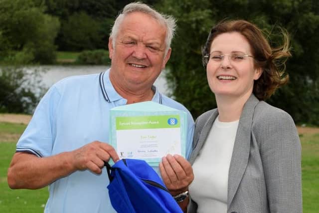 Ken Taylor receives his award from Ursula Lidbetter, chief executive of Lincolnshire Co-op. (PHOTO BY: Chris Vaughan Photography).