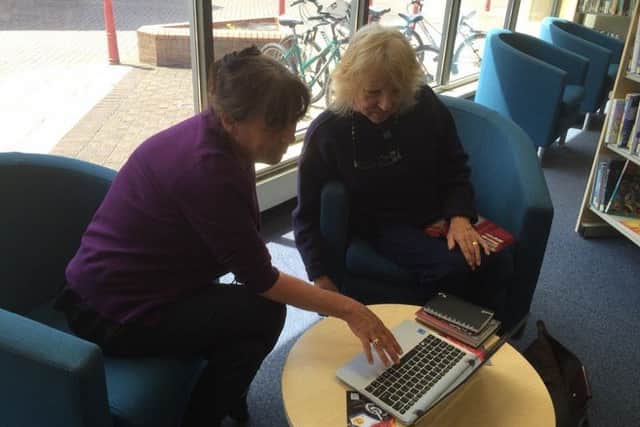 Providing help with IT is one of the activities on offer during National Libraries Week.