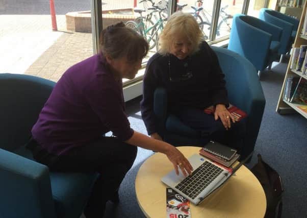 Providing help with IT is one of the activities on offer during National Libraries Week.