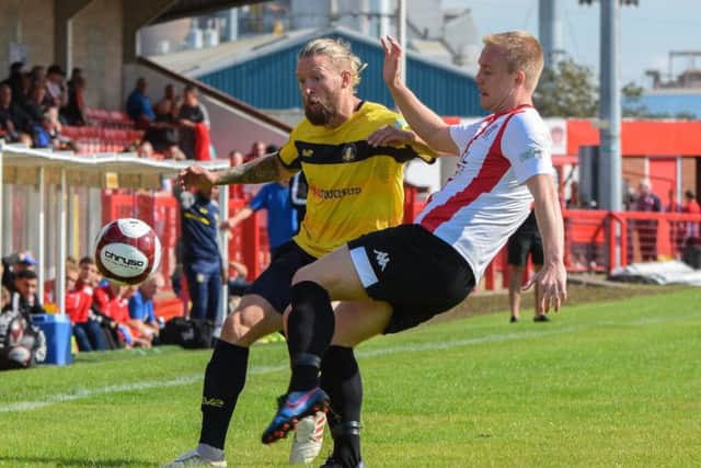 Kingsley James in the thick of the action for Gainsborough Trinity at Witton Albion. (PHOTO BY: John Rudkin)