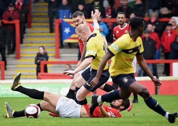 Rough and tumble action during Gainsborough Trinity's 2-2 draw at FC United of Manchester on Saturday. (PHOTO BY: John Rudkin)