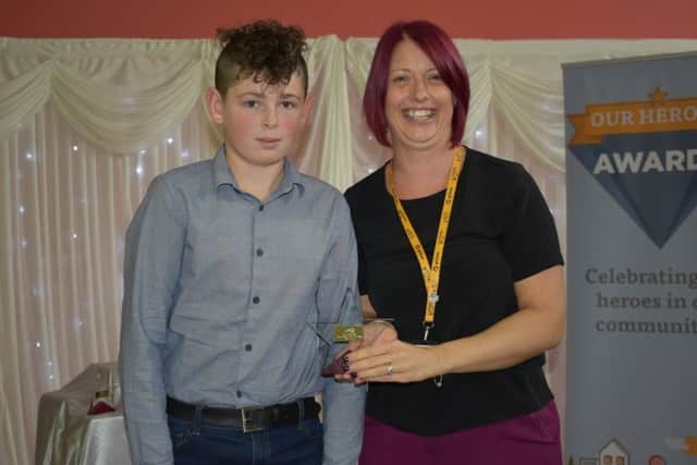 Young Person of the Year winner Archie Smith with head of marketing at Acis, Claire Woodward