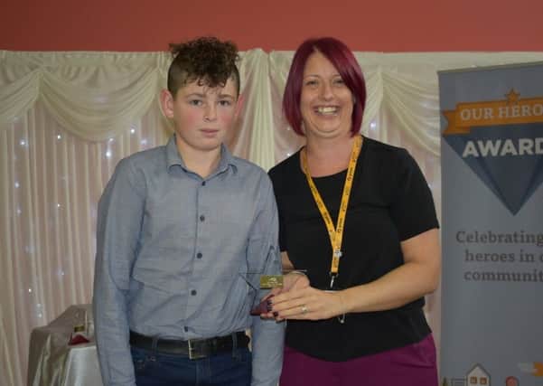 Young Person of the Year winner Archie Smith with head of marketing at Acis, Claire Woodward