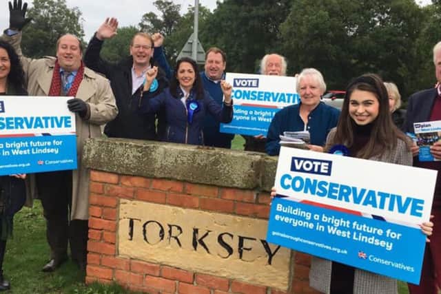 The Conservatives celebrate the by-election victory.
