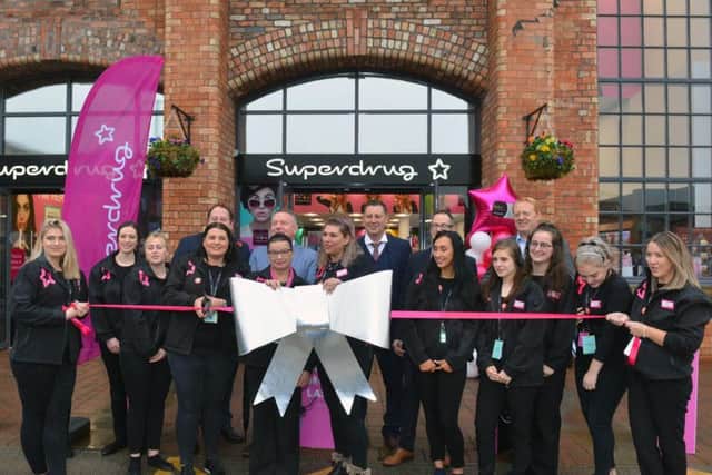 The new Supedrug store opened with a special ribbon cutting.