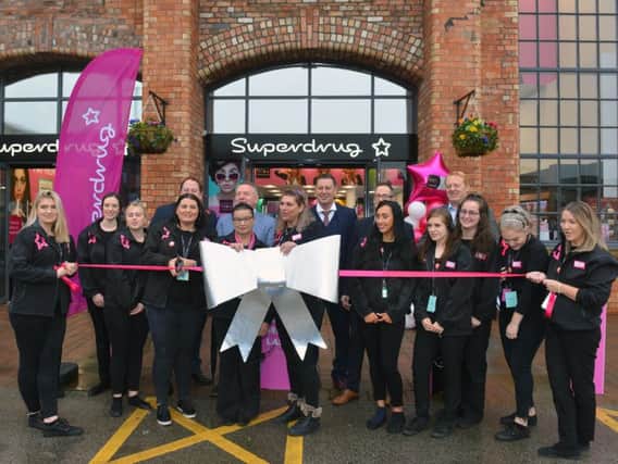 The new Supedrug store opened with a special ribbon cutting.