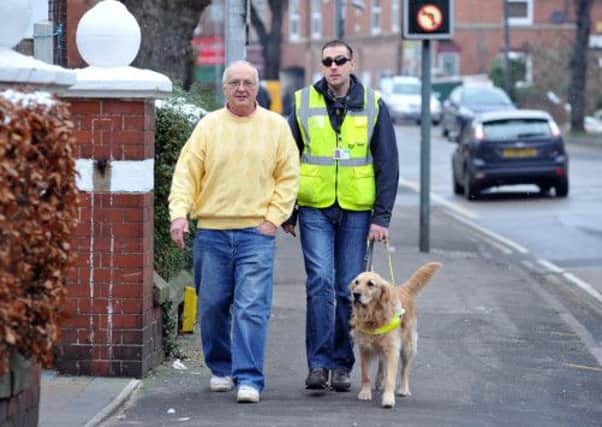 Feature on Worksop Guide Dogs for the Blind group, pictured are Eddie Parry and Steve Bowles with guide dog May (w130117-4)