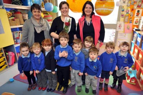 Guardian Rose presentation to Little Acorns Pre-School commitee members. Pictured presenting the rose is Louise Passaseo, left with Kerry Aspinall and Gay Underwood (w130117-2b)