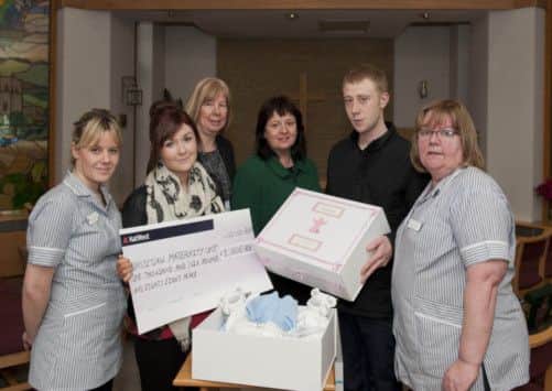 Ashley Baxendale and her partner Alex Wade donated memory boxes and a cheque £1006.88 to the Bassetlaw Hospital Maternity Unit on Tuesday in memory of their baby who was stillborn. At the presentation were (left to right): midwife, Jenna Atherton; clinical lead midwife, Karen Cousins; head of midwifery, Deirdre Fowler and midwife Maura Moss