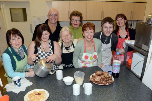 Zacchaeus Project at St John's Church in Worksop. Lawson Main pictured with helpers and volunteers (w130131-2a)