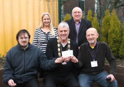 Paul Truin and Jonathan Evans accept a donation from Coun Jon Carratt, Chairman of Maltby Town Council and Coun Jenny Andrews and Coun Keith Stringer