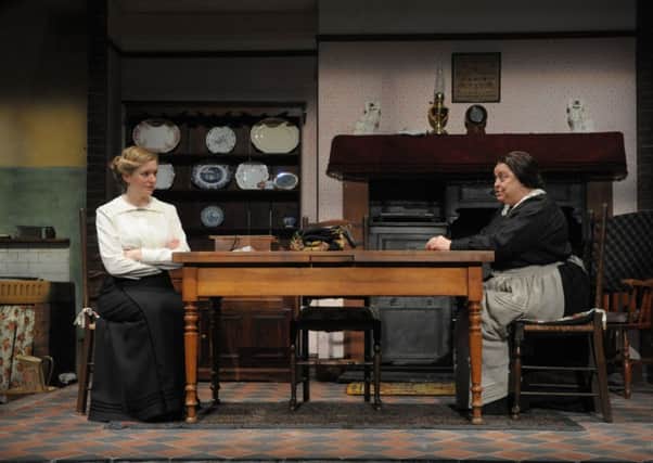 Strife at home . . . Mrs Gascoyne senior (Lynda Baron) has a "'cosy kitchen chat' with the newly wed Mrs Minnie Gascoyne (Claire Price) in a  scene from 'The Daughter-in-Law' at Sheffield's Crucible Theatre. (Photo: Robert Gray)