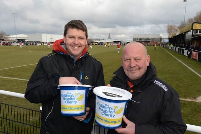 Worksop Town FC in support of the Children's Hospital Charity. Pictured at the Worksop Town v FC United of Manchester match is the Children's Hospital Charity corporate fundraiser Tchad Western and Kev Keep.