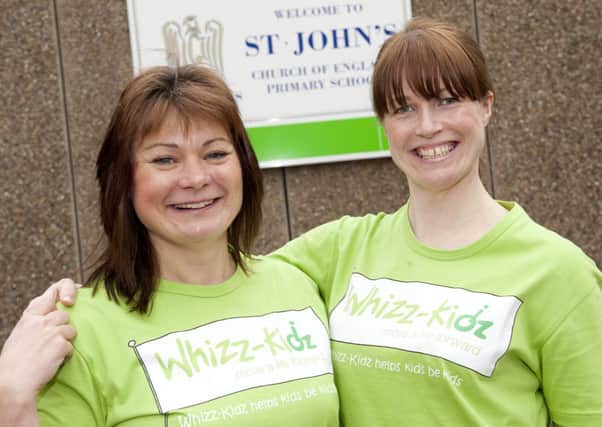 Primary school teacher Rachael Stevens (right) and teaching assistant Linda Foy of St John's School are preparing to run the London Marathon and raise money for Whizz Kidz charity