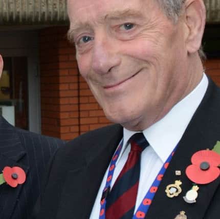 Bassetlaw Council Chairman Ian Campbell and Council leader Coun Simon Greaves pictured buying poppies from Brian Madden (w121023-2b)