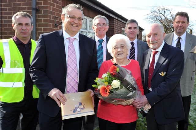 The 6,000th A1 Housing tenant to have work done to her property as part of decent homes scheme, pictured with tenant Kath Greed is Bullock contract manager Paul  Holmes, Director of Environment Services for Bassetlaw Council Mark Ladyman, A1 Vice Chairman Brian Bailey, Mrs Kath Greed, Neil Smith, A1 Vice Chairman Brian Bailey and A1 director of housing and technical service Don Spittlehouse (w130314-2a)