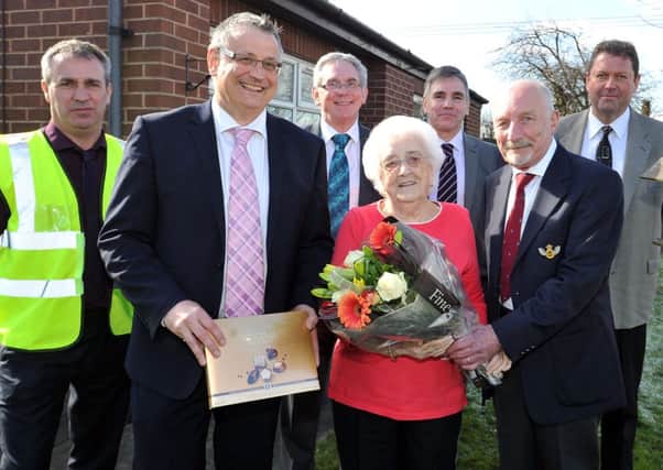 The 6,000th A1 Housing tenant to have work done to her property as part of decent homes scheme, pictured with tenant Kath Greed is Bullock contract manager Paul  Holmes, Director of Environment Services for Bassetlaw Council Mark Ladyman, A1 Vice Chairman Brian Bailey, Mrs Kath Greed, Neil Smith, A1 Vice Chairman Brian Bailey and A1 director of housing and technical service Don Spittlehouse (w130314-2a)