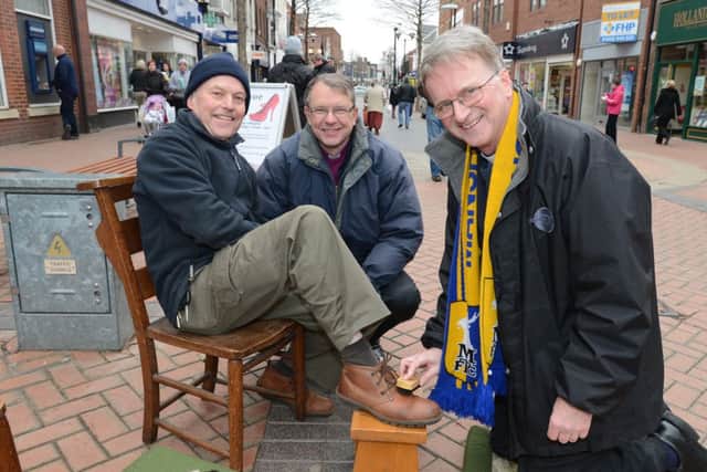 Bishop of Southwell Rt Revd Paul Butler and Bishop of Sherwood Rt Revd Tony Porter shoe shine on Maundy Thursday. Pictiured with Eric James.