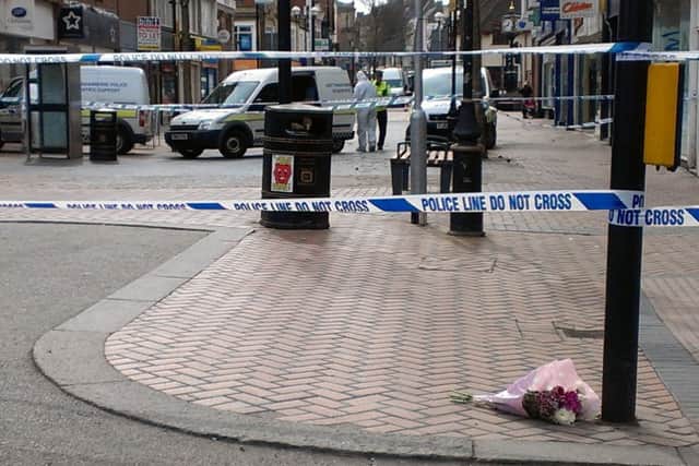 Flowers at the scene where a 40-year-old man died on Saturday night
