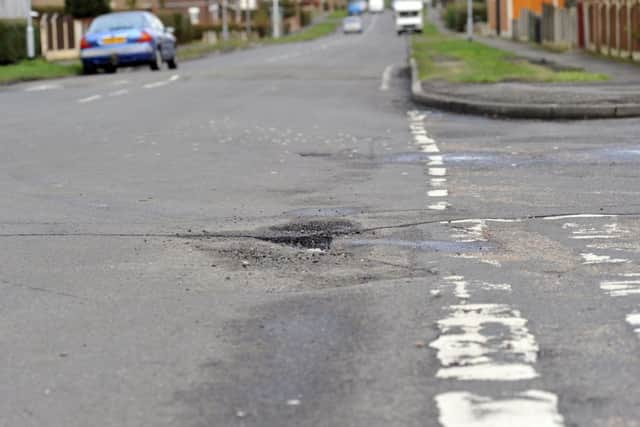 Potholes on the roads in and around Worksop, pictured is junction of Manton Villas (w130206-4k)