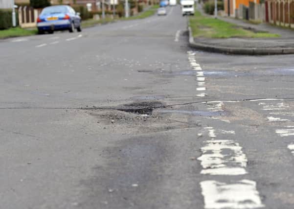 Potholes on the roads in and around Worksop, pictured is junction of Manton Villas (w130206-4k)
