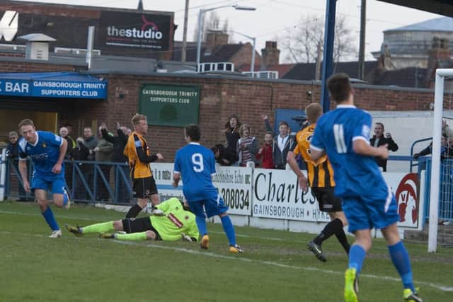 Gainsborough Trinity (blue) score their only goal v Boston United in the the Lincs Senior Shield Final at the Northolme, Gainsborough on Tuesday. Boston ran out winners with a 3-1 victory.